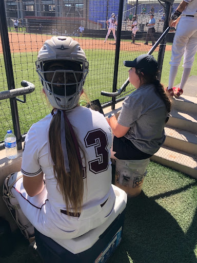 Catcher Jordan Bauer watching fellow teammates  