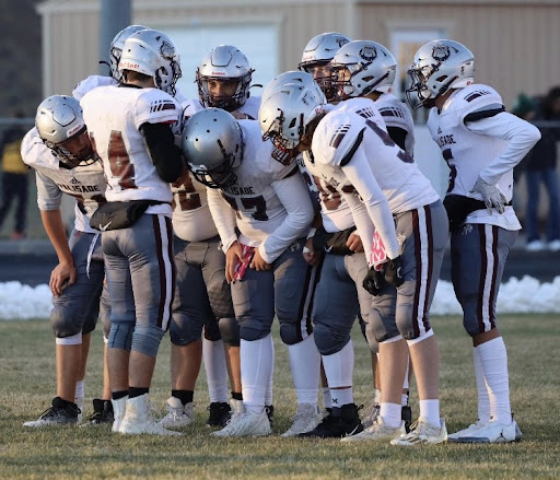 Offensive team 1 in huddle