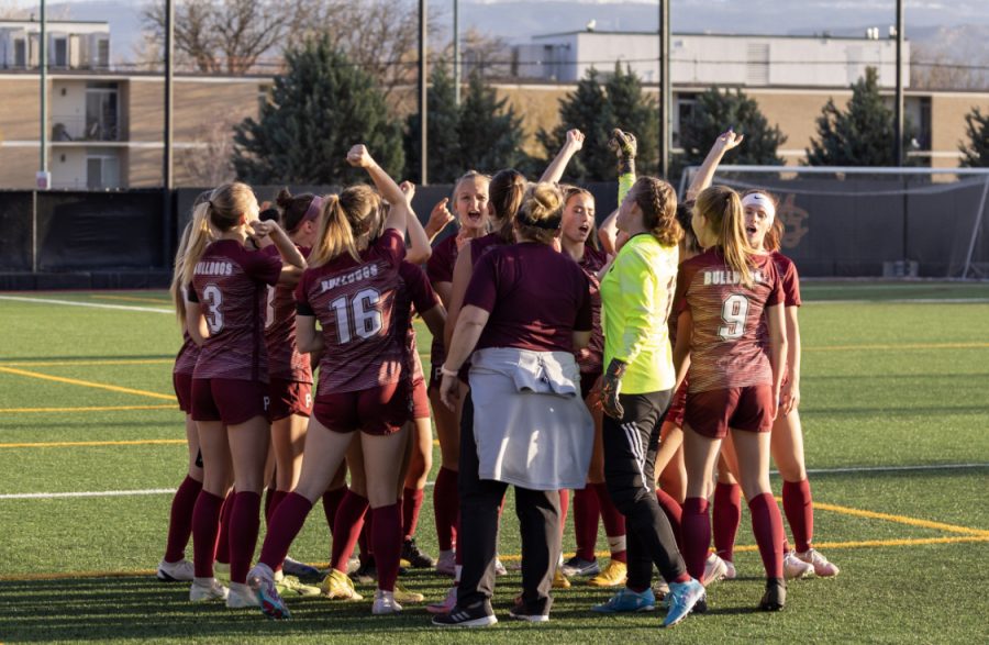 Photo of Bulldog girls in a huddle