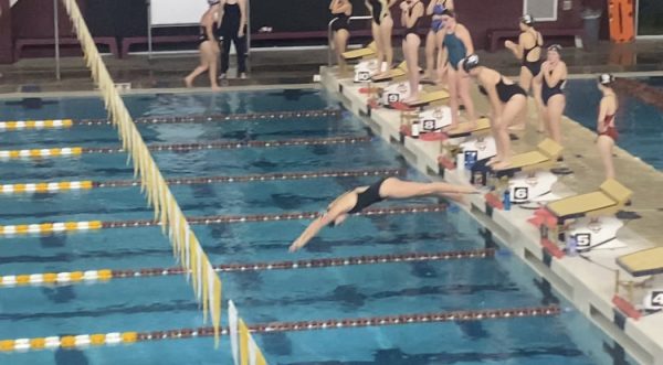 Emily Hardin diving into the competition.