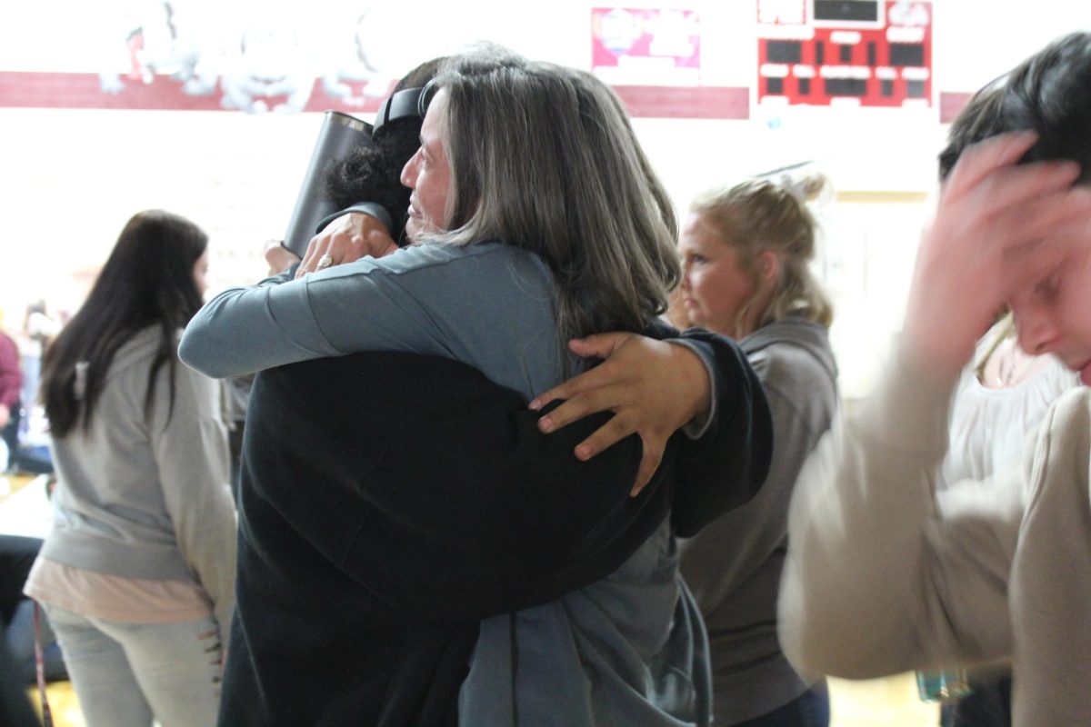 Teacher-student appreciation hug with Cara Korte. 