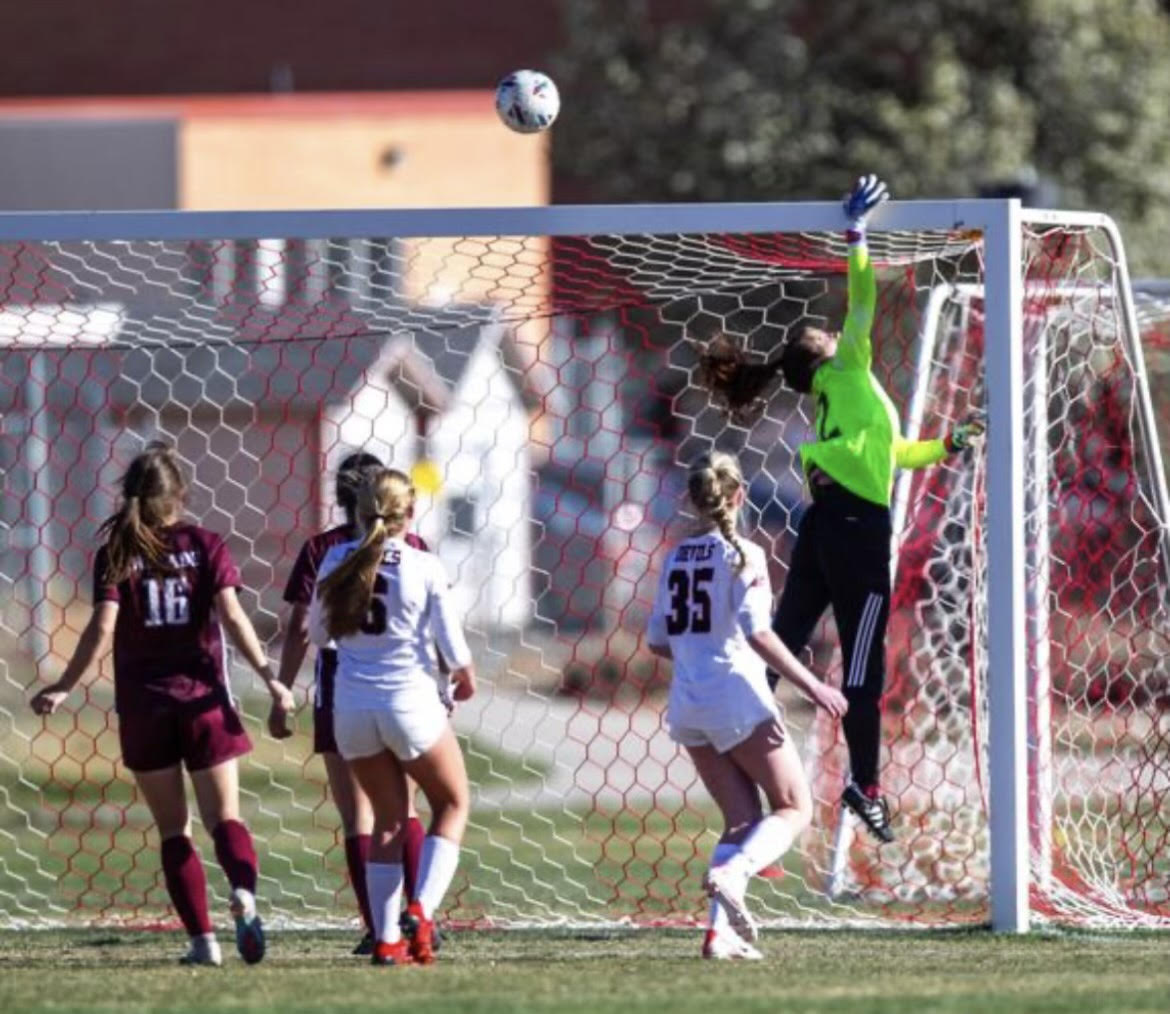 Brenae Snover, Varsity goalie, preventing a goal from the other team. Photo provided by Brenae Snover.