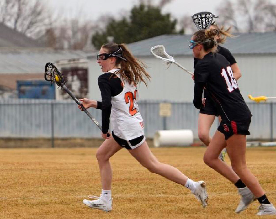The lacrosse team in action during a previous season, provided by Madison Degeorge