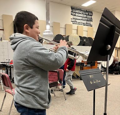 Kevin playing his trumpet.