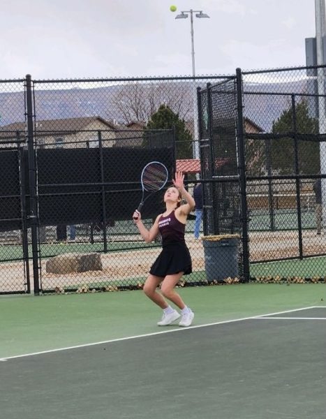 Haley Ammons serving while partner Sydney Maurer gets ready at the net. 
Photo Provided by: Emily Hardin
