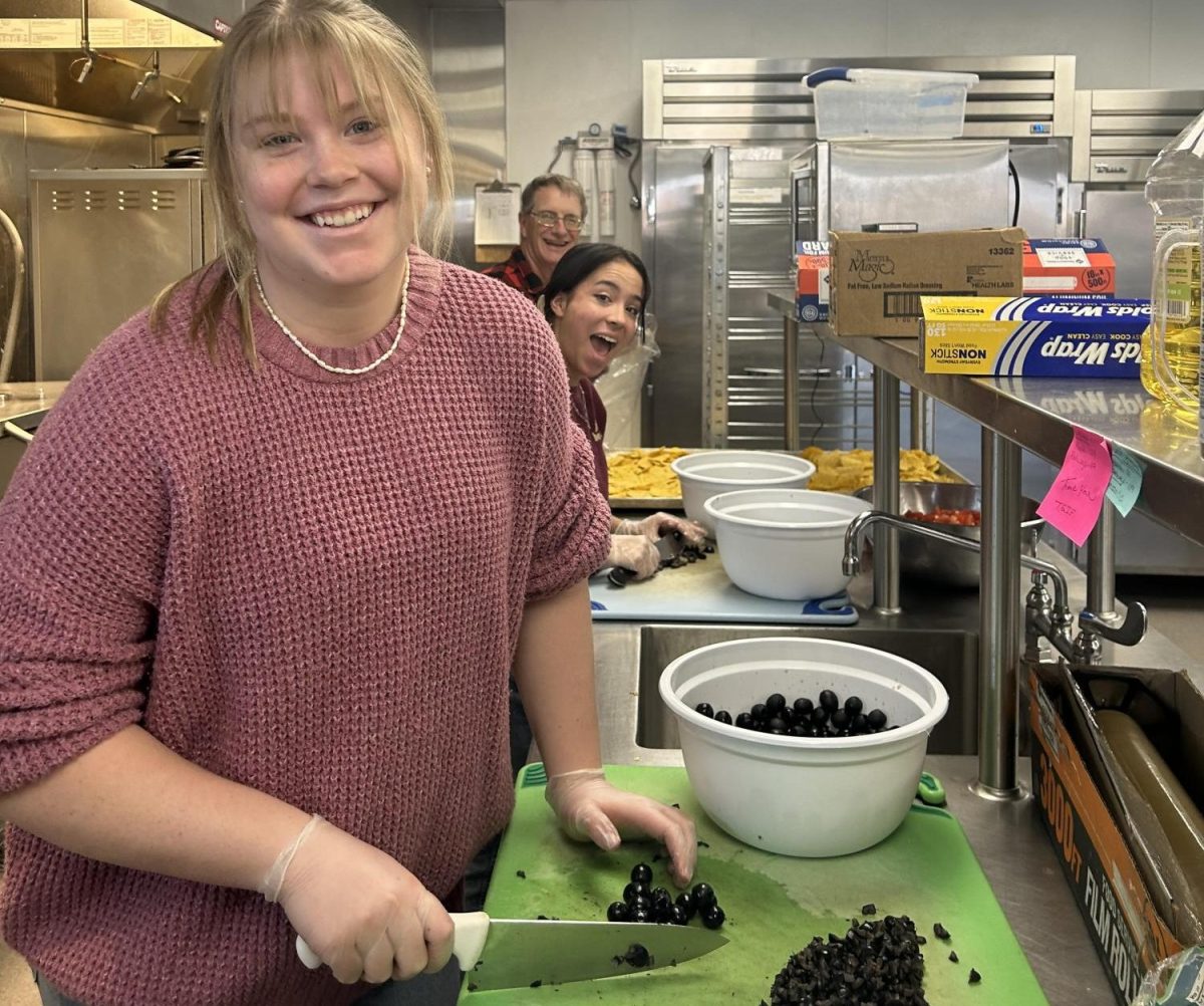 Palisade NHS students helping cook food for the homeless. Photo by: Brielle Sorensen. 