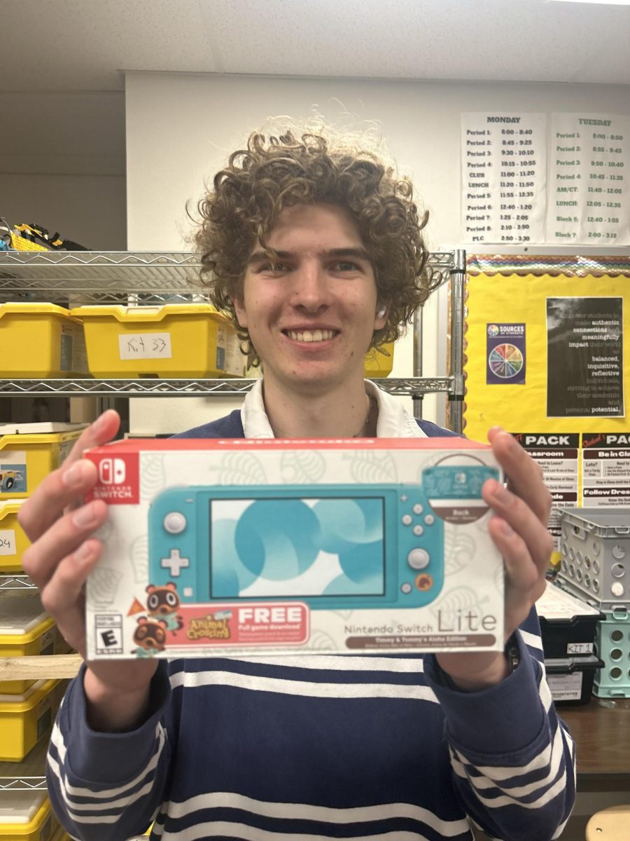 Our co-editor in chief Keegan Seymour with the new Nintendo Switch! Photo by Brielle Sorensen. 