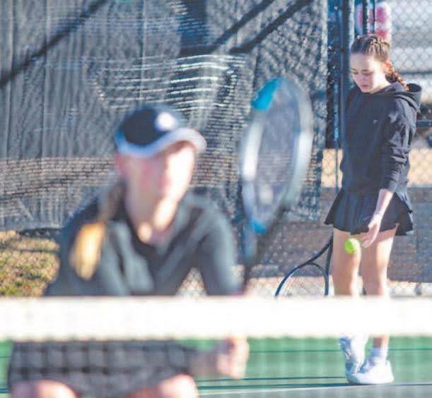 Haley Ammons (Right) as she gets ready to serve. 
Photo taken by Daily Sentinel's Larry Robinson. 