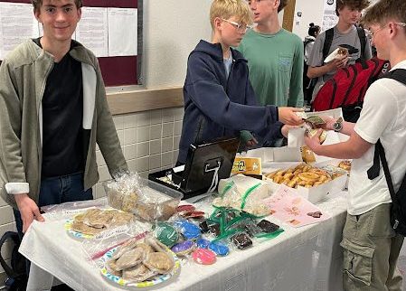 Talan Despain working the bakes sale.