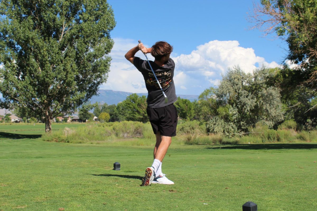 Junior Landon Beville teeing off on hole ten at Chipeta Golf Course