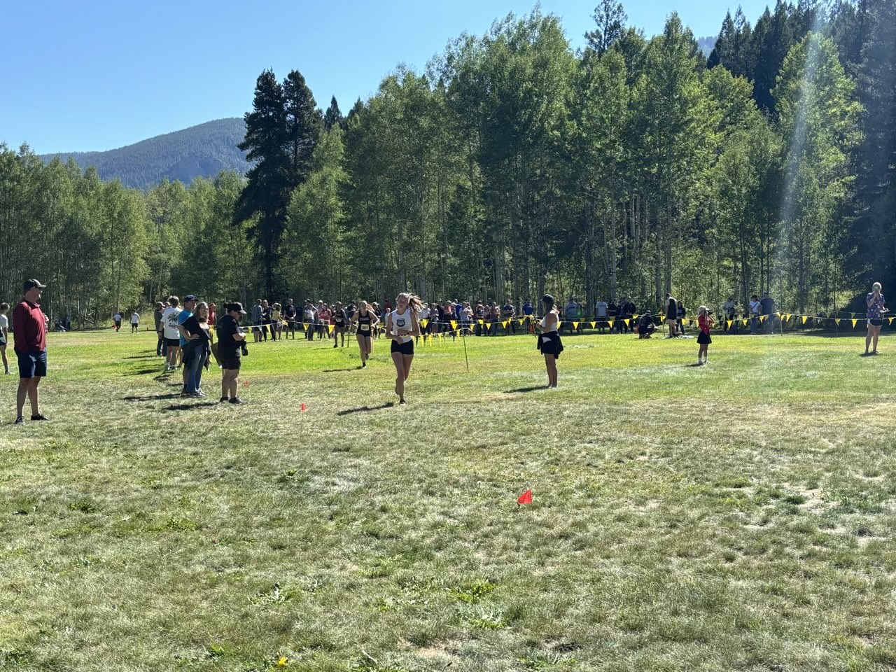 Abby Price racing during a cross country meet.  Photo provided by Abby Price.