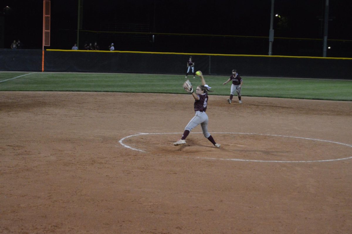 Junior Kenzie Gray pitching. 