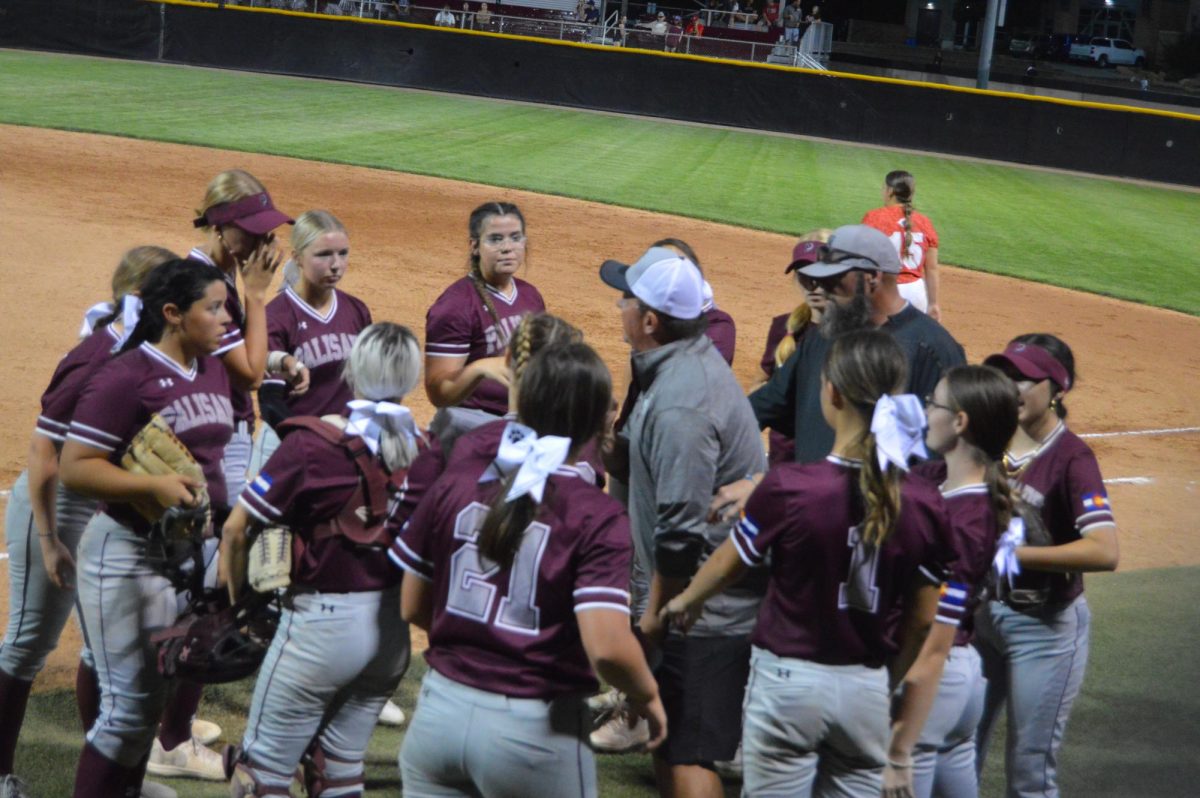 The Palisade softball girls talking strategy. 