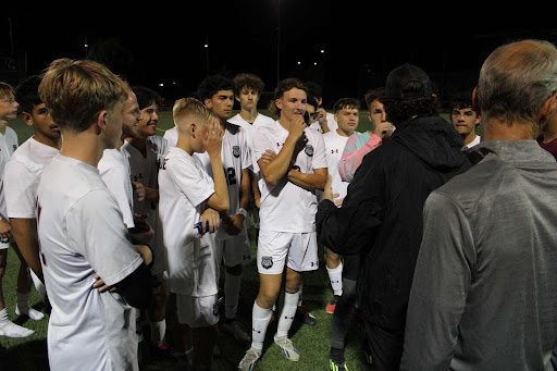 Head Coach Lane Lorenzo talking to his team 