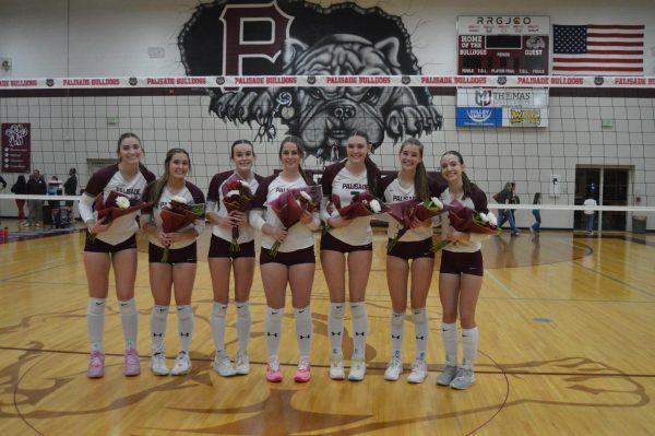 The seven volleyball seniors. Left to right: Sabrina Landman, Kyra Birch, Sarah Foster, Delaney Brinkley, Grace McAnany, Addie Ritterbush, and Braeleigh MacAskill. Photo by Brielle Sorensen. 
