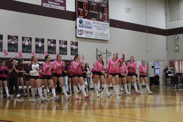 Senior Sarah Foster waves to the crowd before the big game.