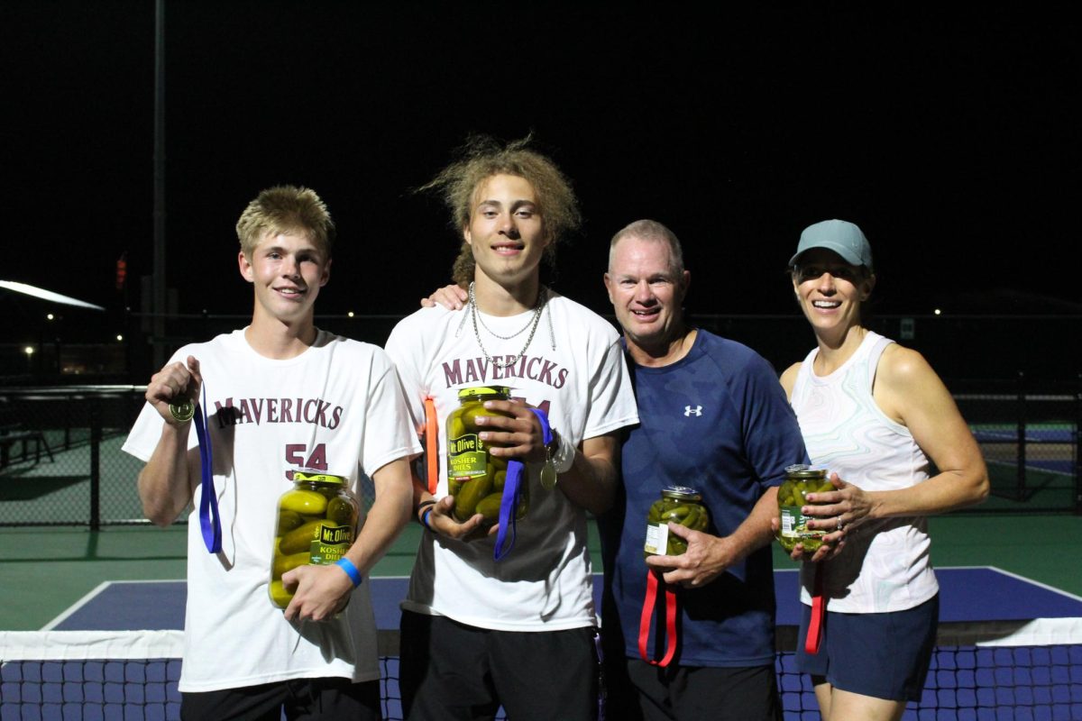 Left to right: Hunter Howard, Easton Embrey, Mr. Rush, and Mrs. Rush with their prizes for competing in the pickleball tournament. Photo by Brielle Sorensen. 