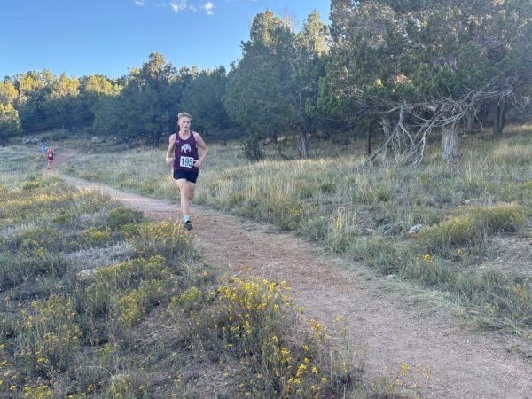 Brody Robinson running at a cross-country meet