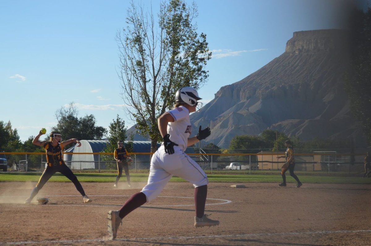 Elizabeth Fleming running for first base during the game against Rifle.