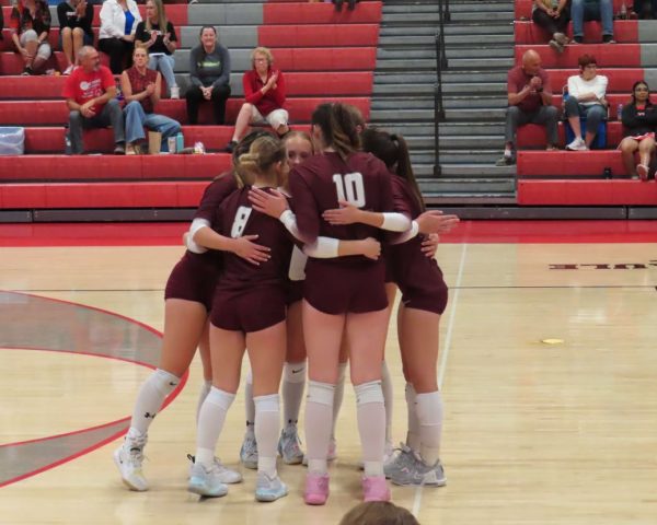 The Varsity Bulldogs huddled up between points. 