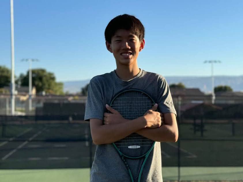 Jack Yu posing for a picture with his tennis racket.
Photo provided by Jack.