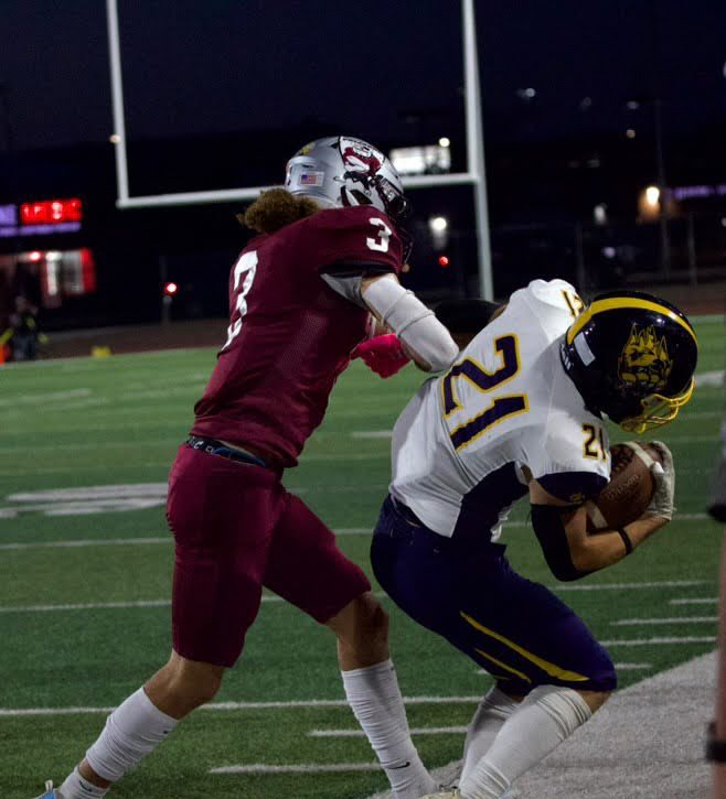 Easton pushing an opponent out of bounds. Photo provided by Easton Embrey.