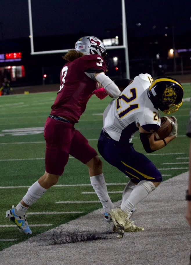 Easton pushing an opponent out of bounds. Photo provided by Easton Embrey.