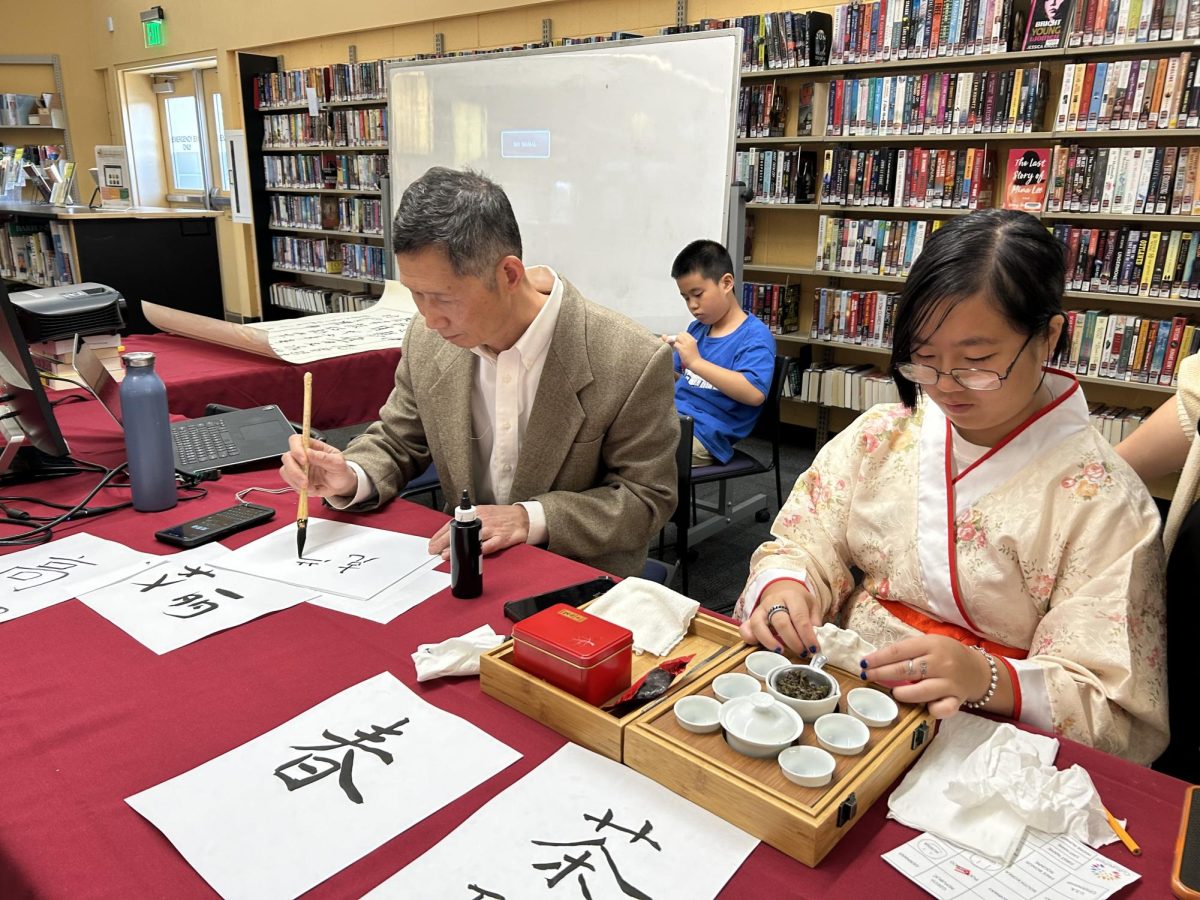 Anabel Yu and her uncle upholding their Chinese heritage through traditional art forms. 