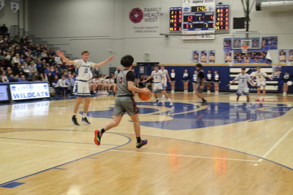 Senior Julian Garza running the court at Fruita Monument High School. 