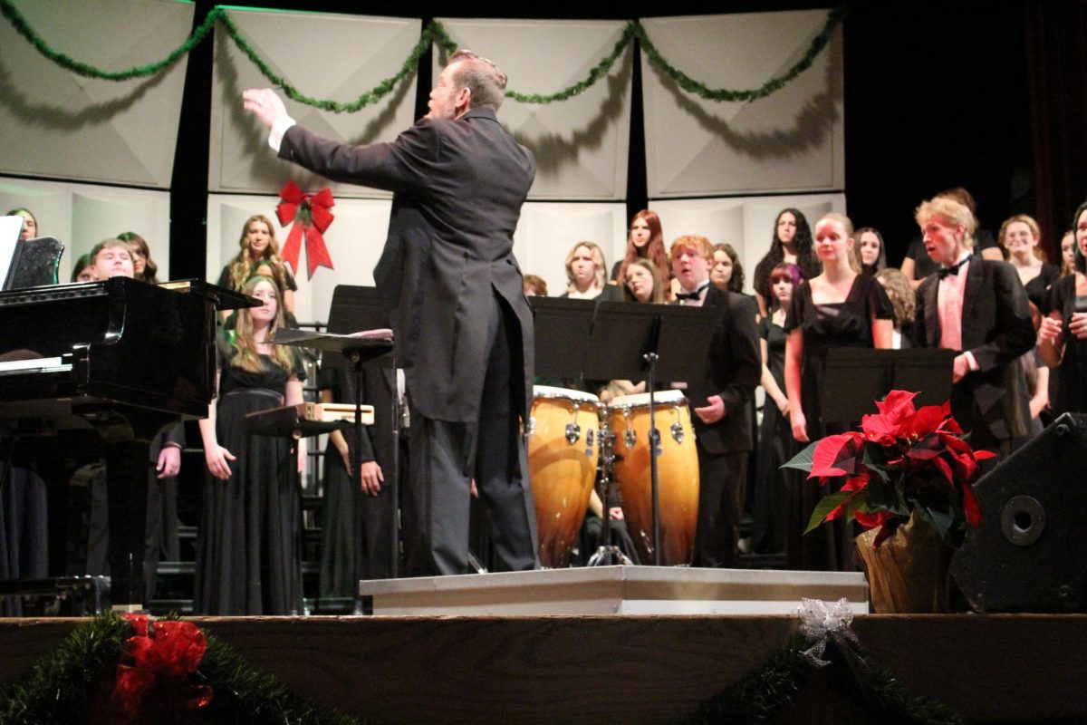 Choir Director Matt Doty directing all five choirs.