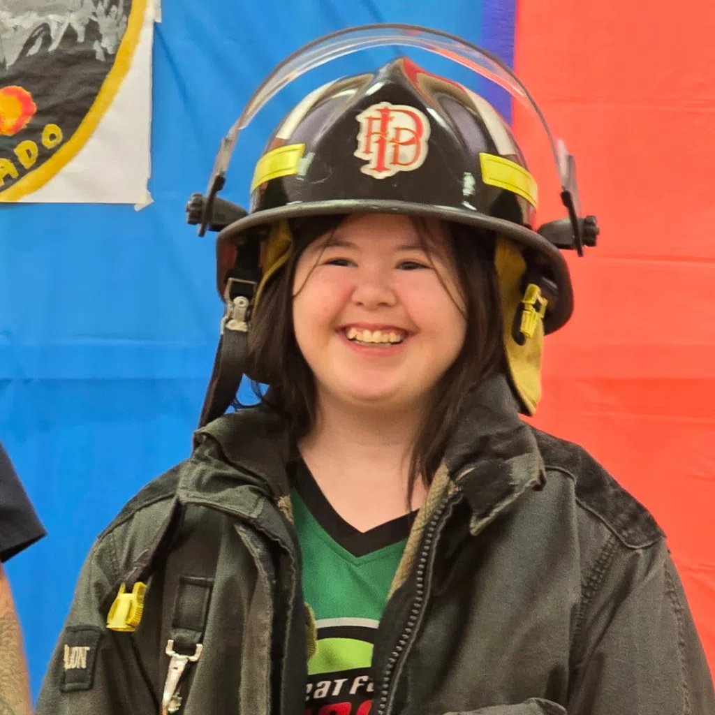 Maggie Brown at the Palisade Fire Station being awarded Special Olympic Athlete of the Month. Photo provided by: Tami Brown. 