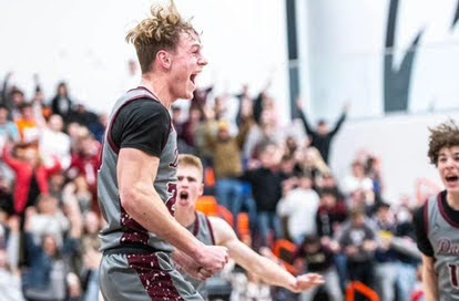 CJ Mullaney full of excitement after his game winning basket against GJHS.