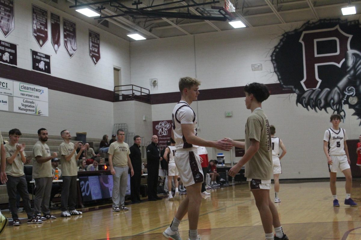 CJ Mullaney and Aidan Shiao doing a handshake before the game. 