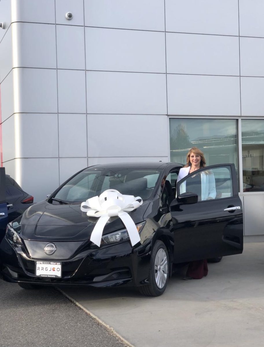 Mrs. Green and her new Nissan Leaf. Photo provided by Mrs. Green.