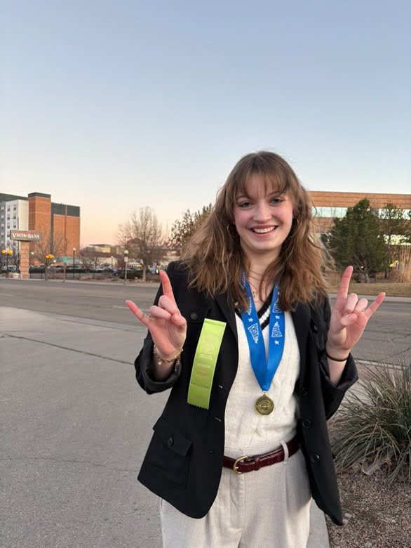 Senior Mila Stepan with her first place medal after state. 