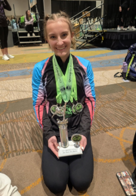 Sophomore Reese Blackburn with her medals and trophy. 