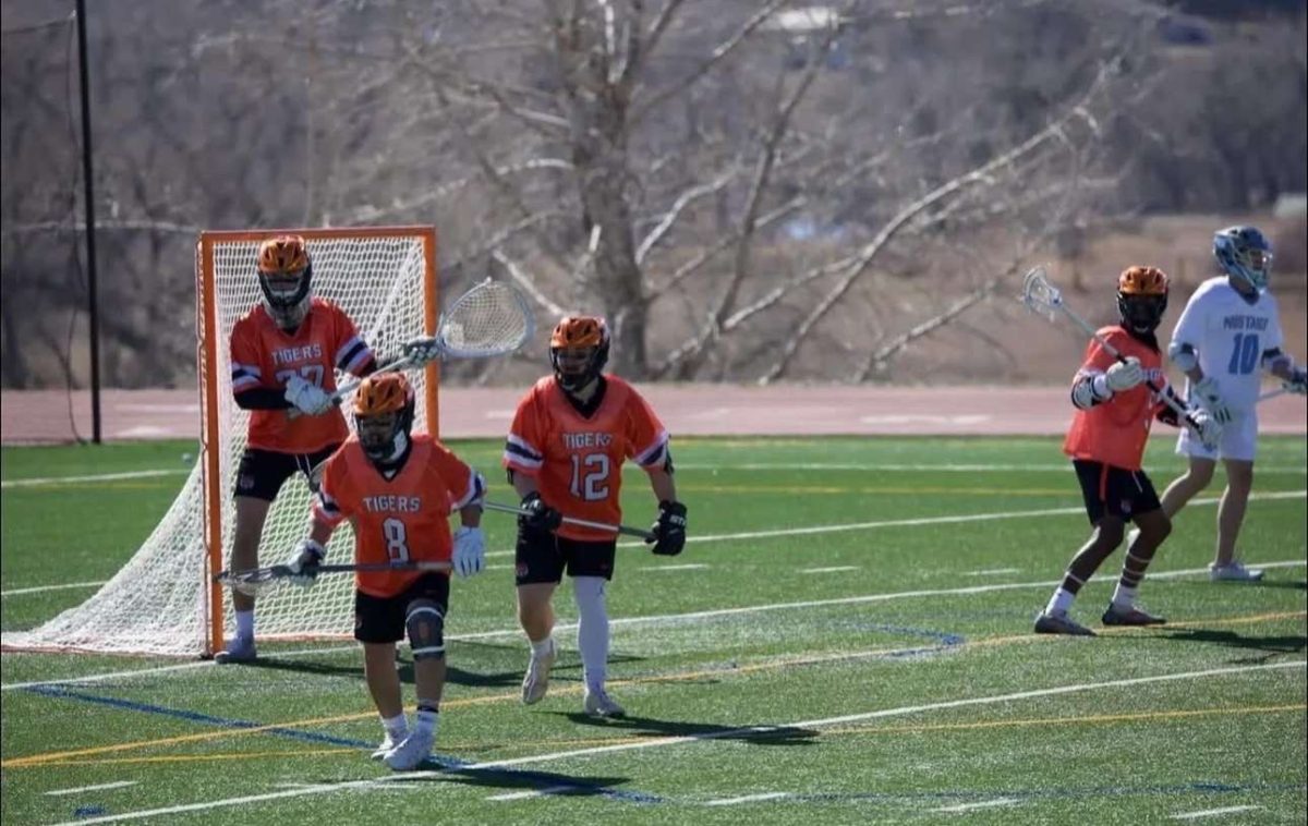 Grand Junction Senior Gordie Steidel, Palisade Senior Joseph Zambrano, and two graduated athletes from Central, Ryan Lombardi and Jay Cameron during a game last season. 