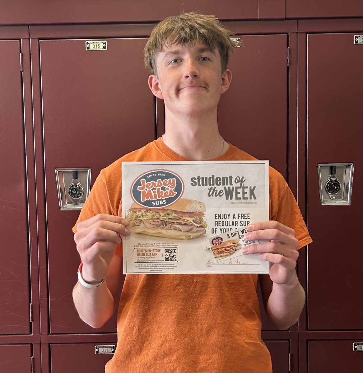 Sophomore Jack Kroeker posing with his Student of the Week award.