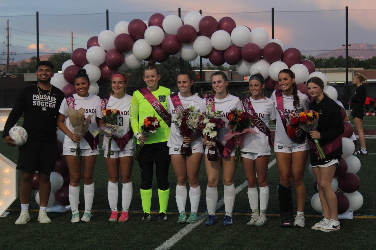 Seniors lined up at halftime to be recognized for their accomplishments. 
