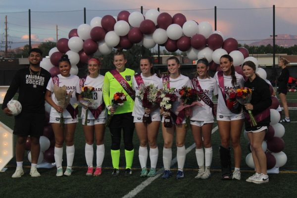 Seniors lined up at halftime to be recognized for their accomplishments. 