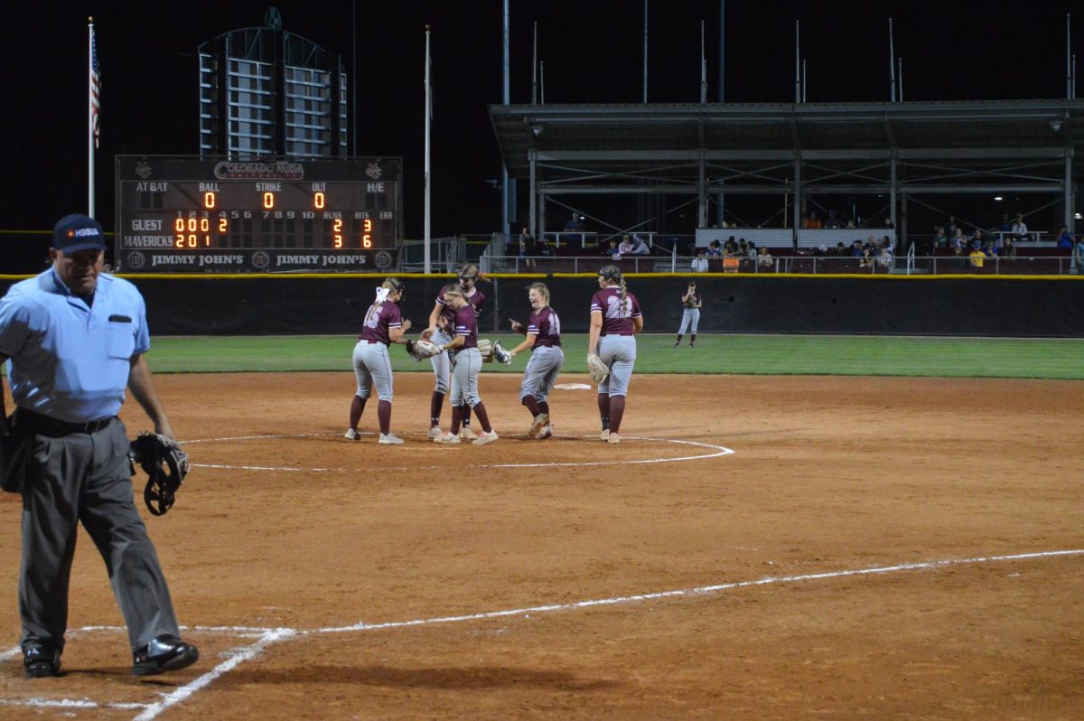 The Palisade High School softball team celebrates during a game from the 2024 season.
