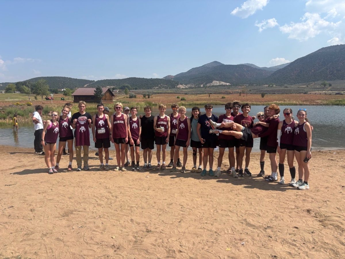 The Palisade Cross Country team demonstrating their motto, 'Bulldogs Run United', following their races. Photo provided by Hank DeFord.
