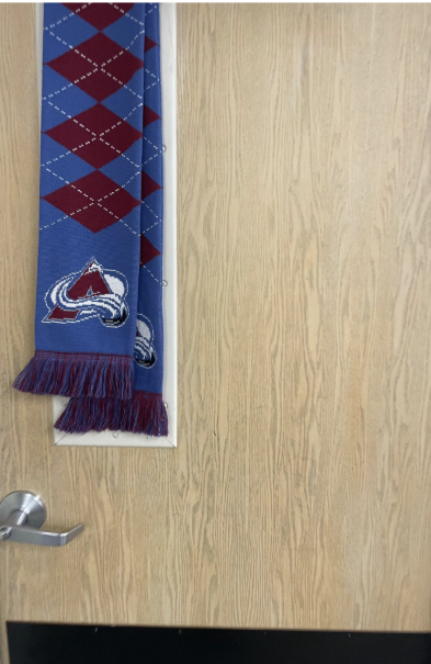 The door closed, locked, and covered to keep any unwanted intruders out of the room.