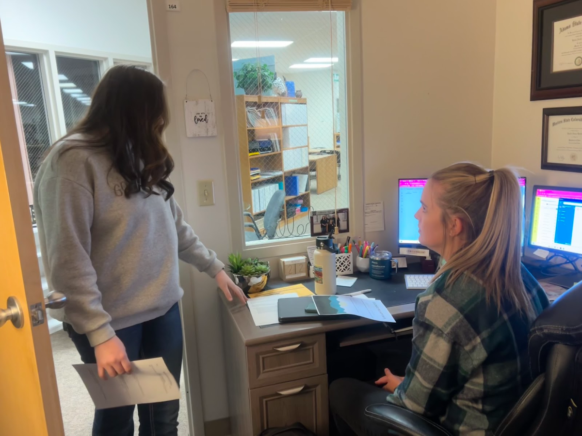 Palisade Senior, Kali Walton, speaking to Ms.Steeves about College Workshop 9/24.