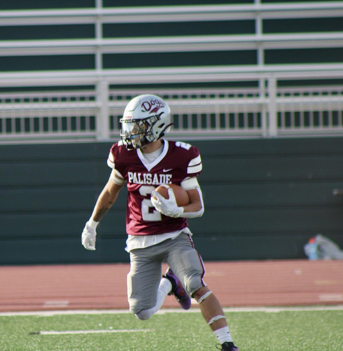 Senior Nathan Umberger running with the ball.