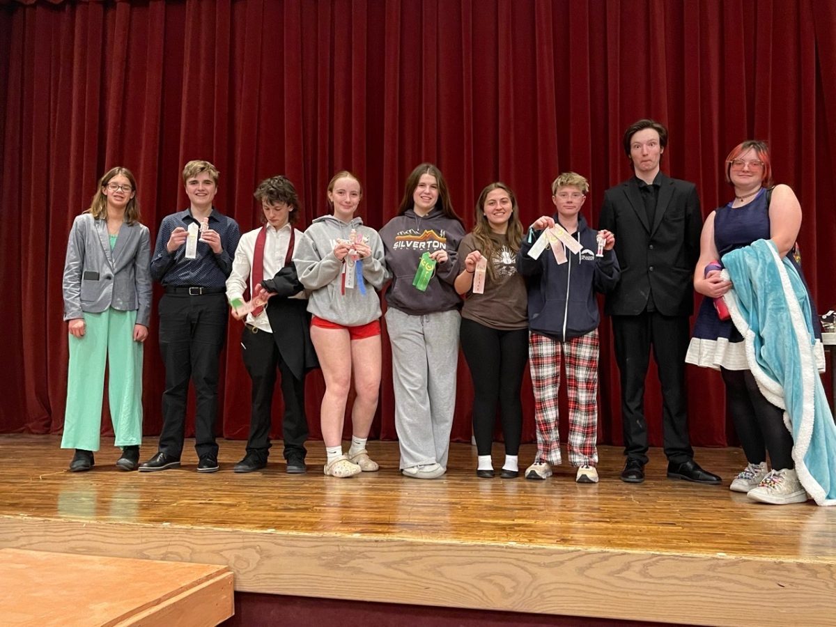 Speech and Debate team, post debate with their winnings. (Photo provided by Mrs.Seremack)