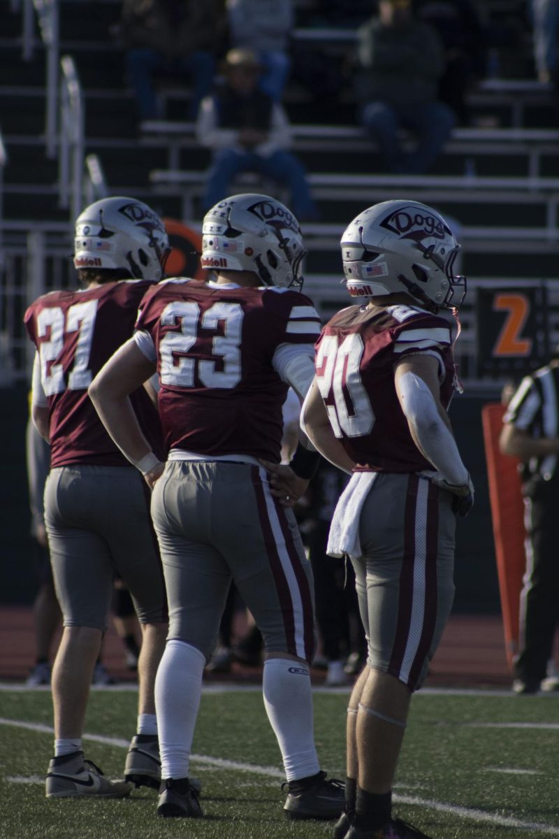 Sophomore, Deigen Salvati, and Seniors, Michale Kemmis and Triston Brinton, playing on offense 