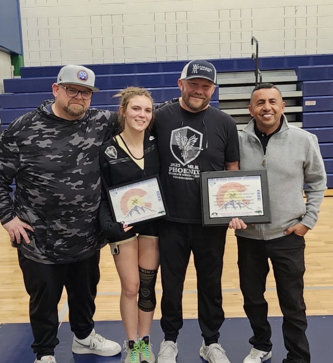 Photo of Addison Fox with her coaches, on the Wrestling mats after winning, and with her family. Photos provided by Addison Fox
