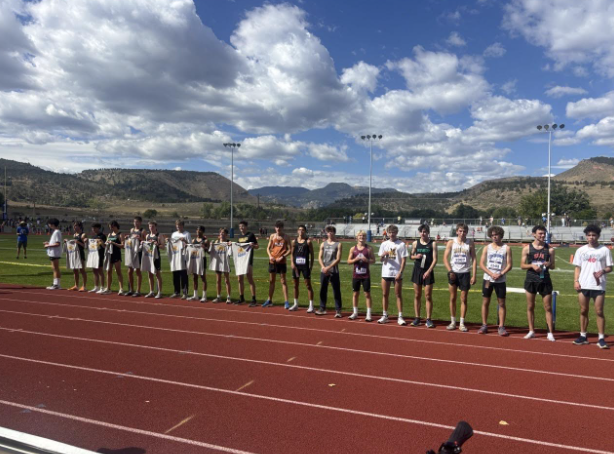 Cross country runners line up for awards.