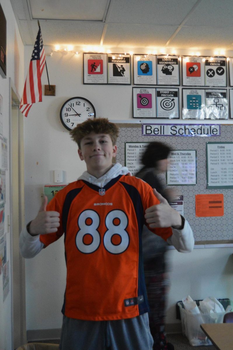 Freshman, Truett Schreiner wearing a Denver Broncos jersey  